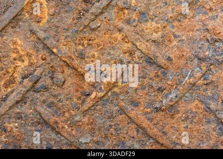 Close up abstract background of rusty metal plate. aged iron surface shows weathered, decaying texture with grunge industrial pattern and heavy corros Stock Photo