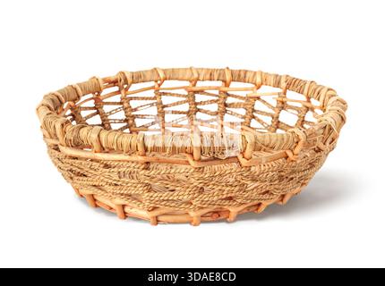 Isolated wicker basket or rattan basket. Weaved pattern. Used for storage, fruits or bread or organizing. Selective focus. White background. Stock Photo