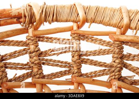 Wicker basket texture. Close up of weaved pattern of rattan or straw storage basket. Used for storage, fruits or bread or organizing. Selective focus. Stock Photo