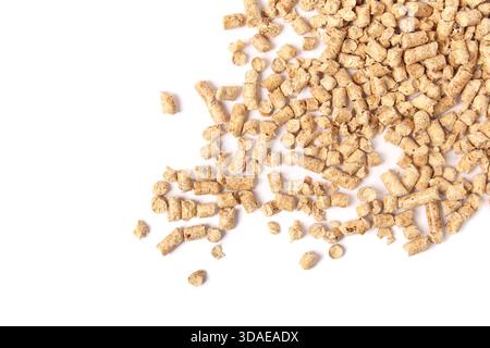Wood pellets falling randomly. Used as cat litter or bio pellets or fuel pellets for heating in stoves or furnaces. Natural alternative to clay litter Stock Photo