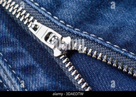Detailed photo of zipper on the blue jeans trousers Stock Photo