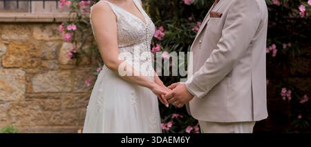 Wedding couple holding hands, Soft focus. Wedding Background Stock Photo