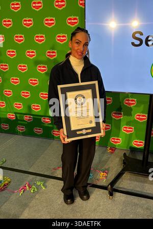 Dominika Gasparova, 35, who peeled and sliced a pineapple in 11.43 seconds - and is now the Guinness World Records title holder. The successful official attempt was at the Del Monte factory in Wisbech, Cambridgeshire, where she works. Picture date: Wednesday December 10, 2025. Stock Photo