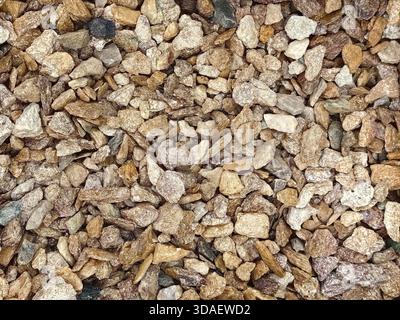 Close-up image of natural stone textures in various shades of brown and beige, creating a rough and earthy background ideal for design projects and ar Stock Photo