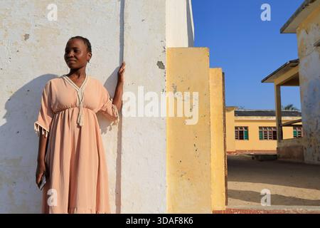 A young woman in abaya outside of the local school in Stone Town on Island of Mozambique,Mozambique Stock Photo