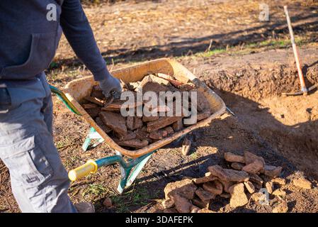Cleaning an excavation or construction site, hard work. Stock Photo