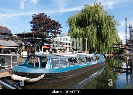 Water bus in Regents Canal near Camden Market, London, England Stock Photo