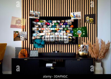 VOD multimedia TV streaming concept with hand holding remote control Stock Photo