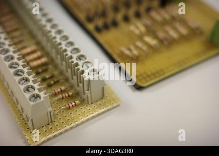 Electronic circuit board with resistors and terminal blocks Stock Photo