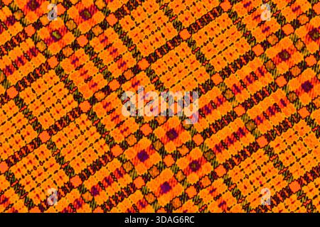 Colored dots on orange background Solarization Stock Photo