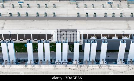 The rooftop infrastructure of a large data center, with numerous ventilation and cooling systems. Stock Photo
