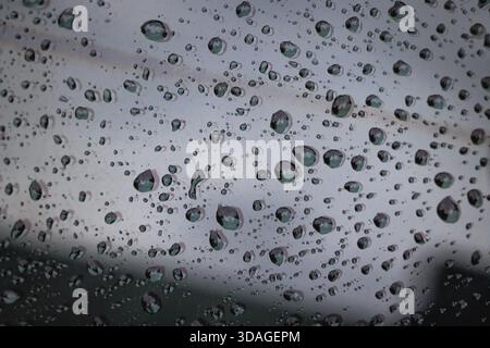 Close up on a raindrops on a window surface Stock Photo