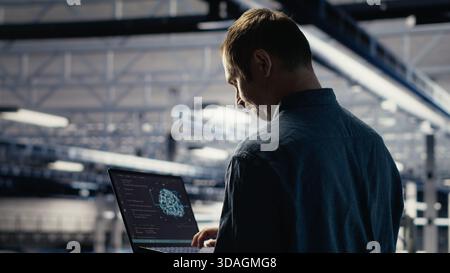 Technician monitors server room activity using laptop while walking through facility. Data center IT professional reviews rigs tests results to ensure systems are working correctly, camera B Stock Photo