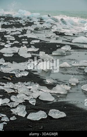 Small pieces of ice on the shore of Diamond beach in Iceland Stock Photo