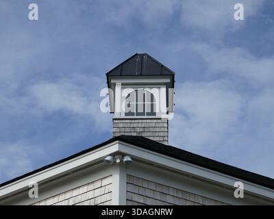 Cupola architectural roof feature with high window with cloudy blue sky background Stock Photo