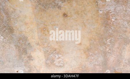 Warm Beige and Tan Abstract Concrete Background with Aged Stains, Grunge Texture, and Rough Patina Stock Photo