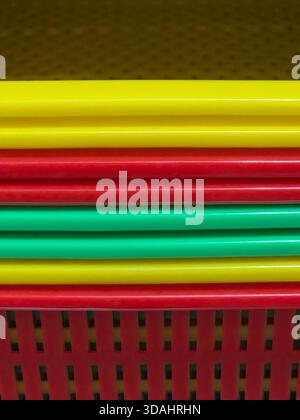 Vibrant abstract background with colorful pattern of red, yellow, and green lines. This graphic design features bright, striped texture and geometric Stock Photo