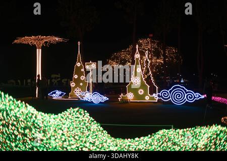 Magical night garden view with glowing light installations and vibrant decoration. This beautiful fantasy illumination creates an enchanting and festi Stock Photo