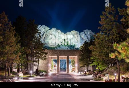 Mount Rushmore National Memorial features illuminated presidents faces at night in South Dakota, USA. Historic sculpture of Washington, Jefferson, Roo Stock Photo