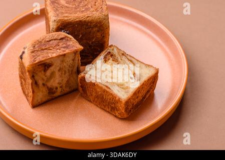 A French cube croissant with chocolate filling, a sweet breakfast pastry. Cube croissant as a food background for your design Stock Photo