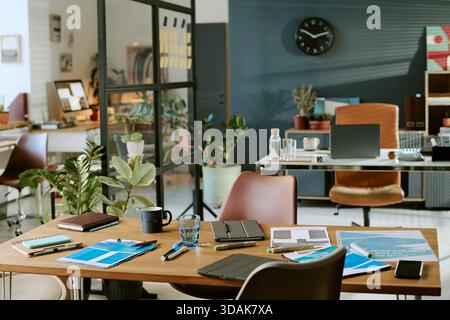 Modern Office Workspace Featuring Documents and Digital Devices on Table Stock Photo