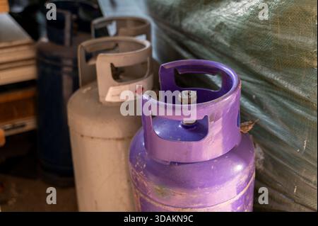 Close-up view shows two gas cylinders stored in garage for reserve use Stock Photo