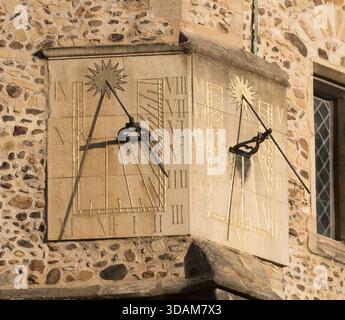 The double faced sundial on St Botolphs church in Cambridge, England, UK Stock Photo