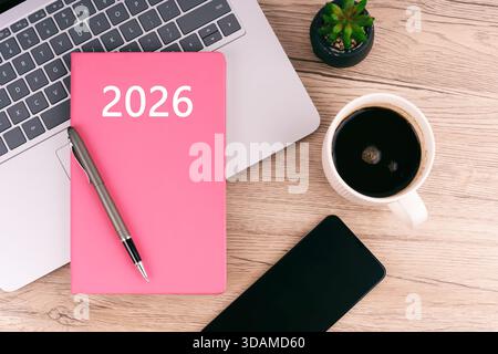 Modern workspace flat lay with a 2025 planner, laptop, coffee and smartphone Stock Photo