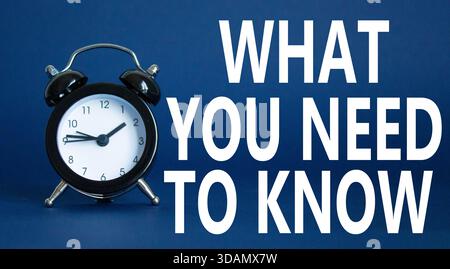 What You need to Know symbol. Wooden blocks with words What You need to Know. Beautiful deep blue background with alarm clock. Business and What You n Stock Photo