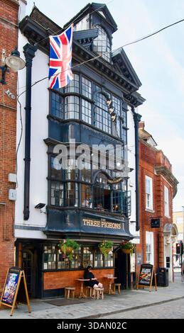 Jacobean revival facade of the rebuilt 1918 traditional English army pub the Three Pigeons High Street Guildford Surrey England United Kingdom Europe Stock Photo