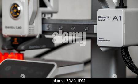 Jurmala, Latvia - 14.10.2025: Close-up 3D printer Bambu Lab A1 with AMS. 3D printer Bambu Lab A1 in action showcasing advanced technology and precise Stock Photo