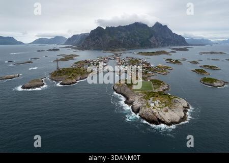 Aerial view of the Lofoten landscape featuring a winding coastal road ...
