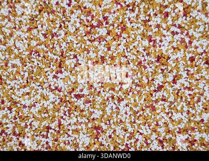 decorative multicolored mosaic granulated wall plaster texture Stock Photo