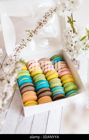 Many colorful macaroons in a white box Stock Photo