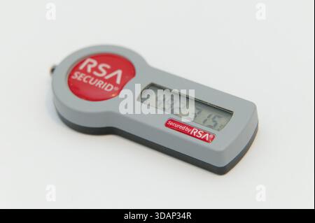 Macro photo of an RSA SecurID security token displaying a digital code on a clean white background. Stock Photo