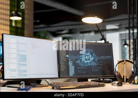 Advanced AI algorithms running on computer monitor in empty startup workspace. Artificial intelligence coding platform used to deploy machine learning models on PC screens Stock Photo