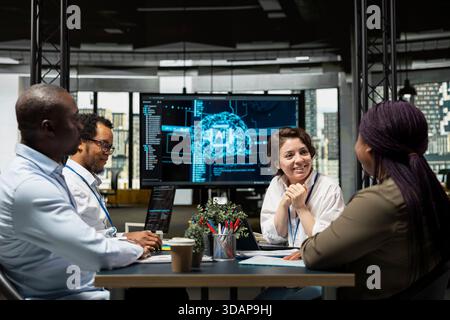 Investors doing meeting in conference room to talk about AI large language models solutions increasing productivity. AI startup boardroom members discussing neural network tech development roadmap Stock Photo