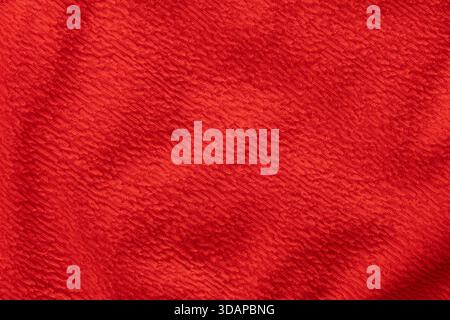 Bright red textured fabric background surface Stock Photo