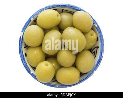 Many green olives in small blue cup isolated on white Stock Photo