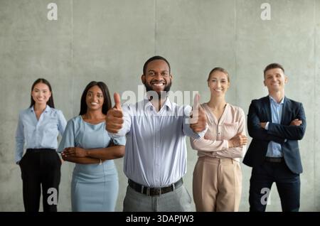 Successful Business Team Celebrates Achievement in Modern Office Setting With Confident Leadership Stock Photo