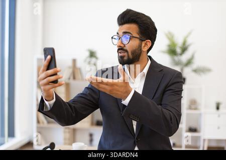 Arab Businessman on Video Call Stock Photo