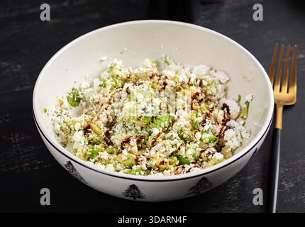 Avocado ricotta salad appetizer with soy sauce. Healthy food. Stock Photo