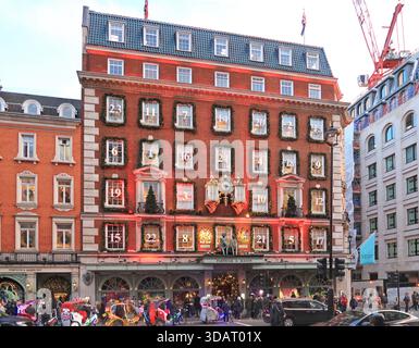 London, UK. Christmas decorations on the exterior of Fortnum & Mason's store on Piccadilly. Photographed at dusk. Christmas 2025. Stock Photo