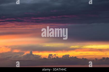 Nature’s abstract masterpiece: vivid colors and soft light creating a unique, inspiring, and mesmerizing texture across the vast heaven canvas. Stock Photo