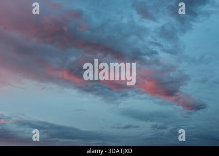 Close-up of the sky only, highlighting the marvelous fusion of dramatic light and subtle, gentle color transitions. Perfect for backgrounds. Stock Photo