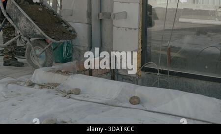 Construction worker on building site using a smartphone to communicate Stock Photo