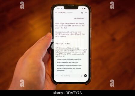 Person's hand holding an iPhone using the OpenAI GPT-5.1 model within the ChatGPT app, Lafayette, California, November 13, 2025. (Photo by Smith Collection/Gado/Sipa USA) Stock Photo