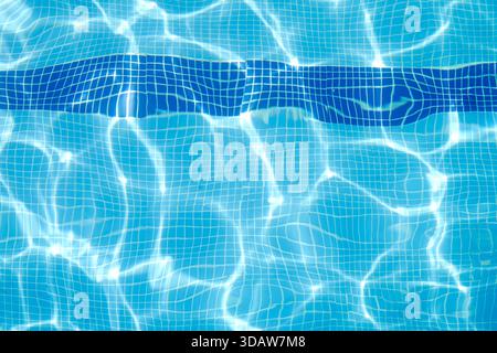 Captivating sunlight glistens on the surface of a clear, blue swimming pool, creating a refreshing and inviting environment. The grid pattern adds dep Stock Photo
