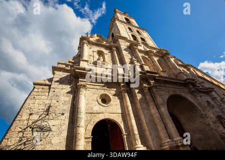 From below an impressive view of a historic Catholic cathedral in Havana, Cuba, showcasing its intricate architecture. Located near El Capitolio and E Stock Photo