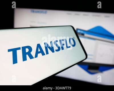 Stuttgart, Germany - 11-30-2025: Smartphone with logo of US logistics technology company Transflo on screen in front of website. Stock Photo